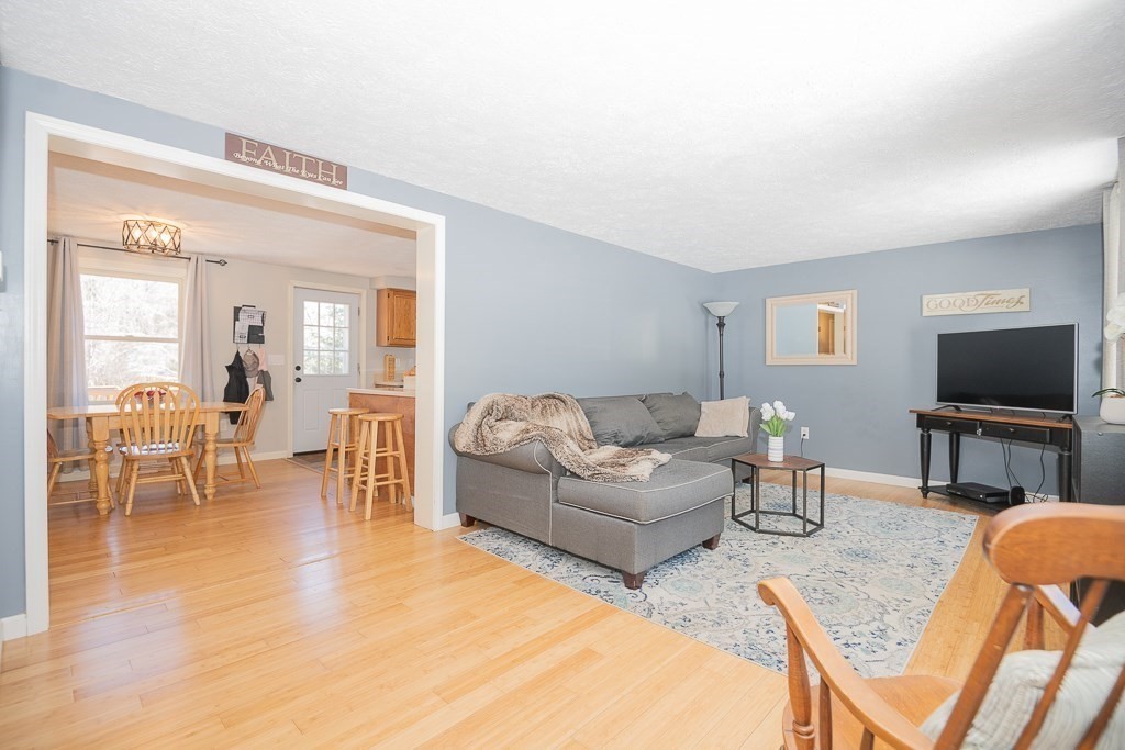 112 Barre Paxton Road Rutland, MA 01543 - Photo 7 of 36 a living room with furniture and a flat screen tv