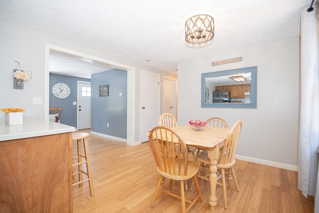 112 Barre Paxton Road Rutland, MA 01543 - Photo 8 of 36 a view of a dining room with furniture and wooden floor