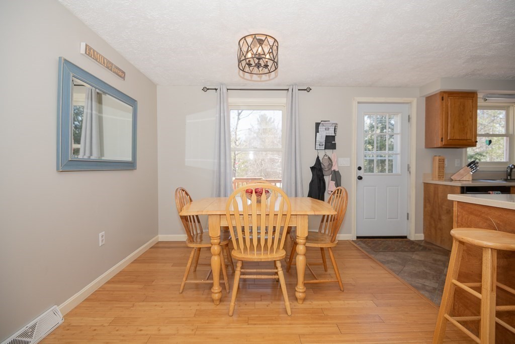 112 Barre Paxton Road Rutland, MA 01543 - Photo 10 of 36 a view of a dining room with furniture window and wooden floor