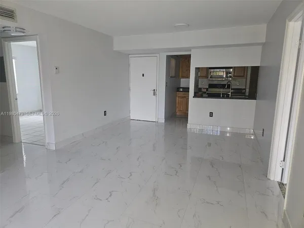 an empty room with a bathroom