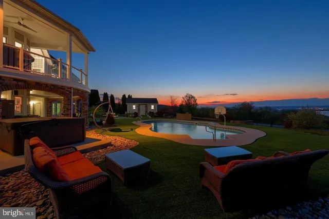 a view of an house with swimming pool and outdoor space