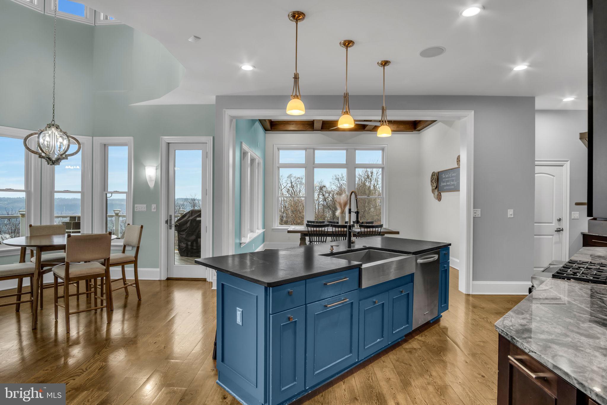 297 Thorley Road New Cumberland, PA 17070 - Photo 32 of 99 a kitchen with granite countertop a stove and a view of living room