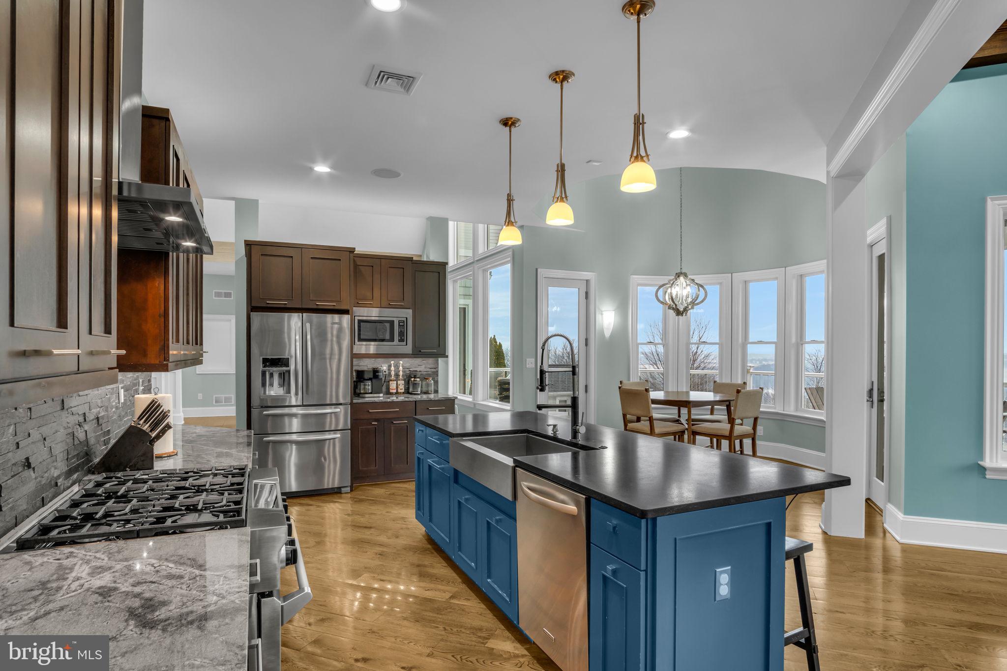 297 Thorley Road New Cumberland, PA 17070 - Photo 33 of 99 a kitchen with refrigerator a oven and chairs