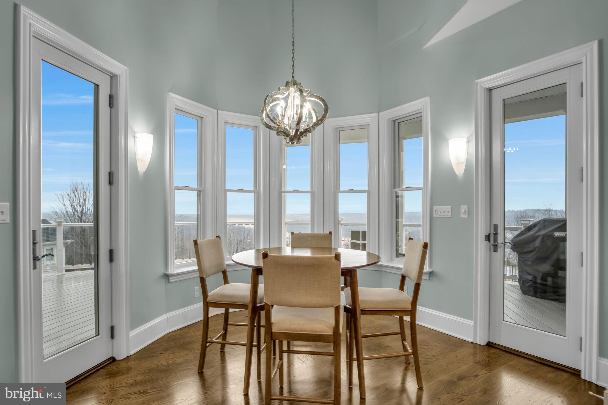 297 Thorley Road New Cumberland, PA 17070 - Photo 40 of 99 a view of a dining room with furniture wooden floor and a chandelier