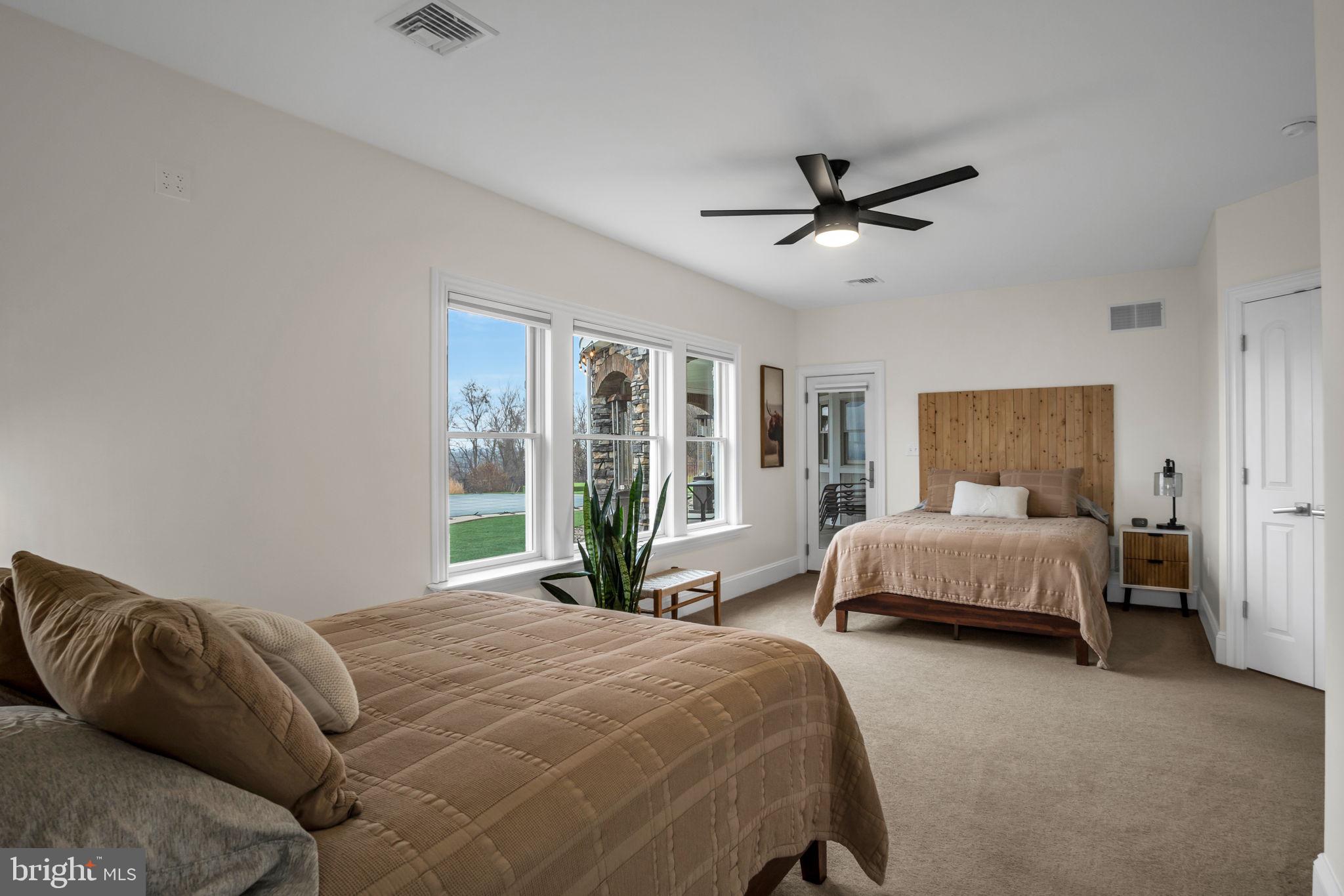 297 Thorley Road New Cumberland, PA 17070 - Photo 61 of 99 a bedroom with a large bed and a large window