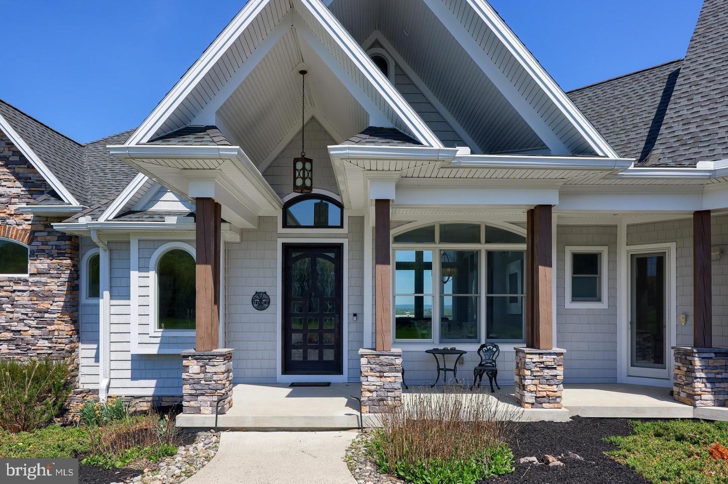 297 Thorley Road New Cumberland, PA 17070 - Photo 82 of 99 a front view of a house with outdoor seating and windows