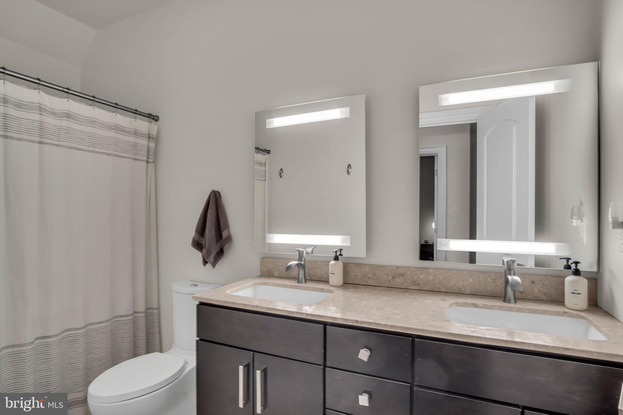 297 Thorley Road New Cumberland, PA 17070 - Photo 95 of 99 a bathroom with a granite countertop sink a toilet and a mirror