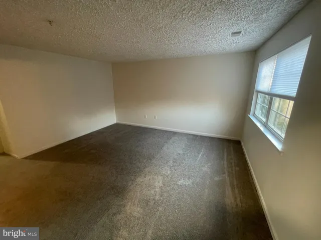 a view of storage and utility room with racks on the wall
