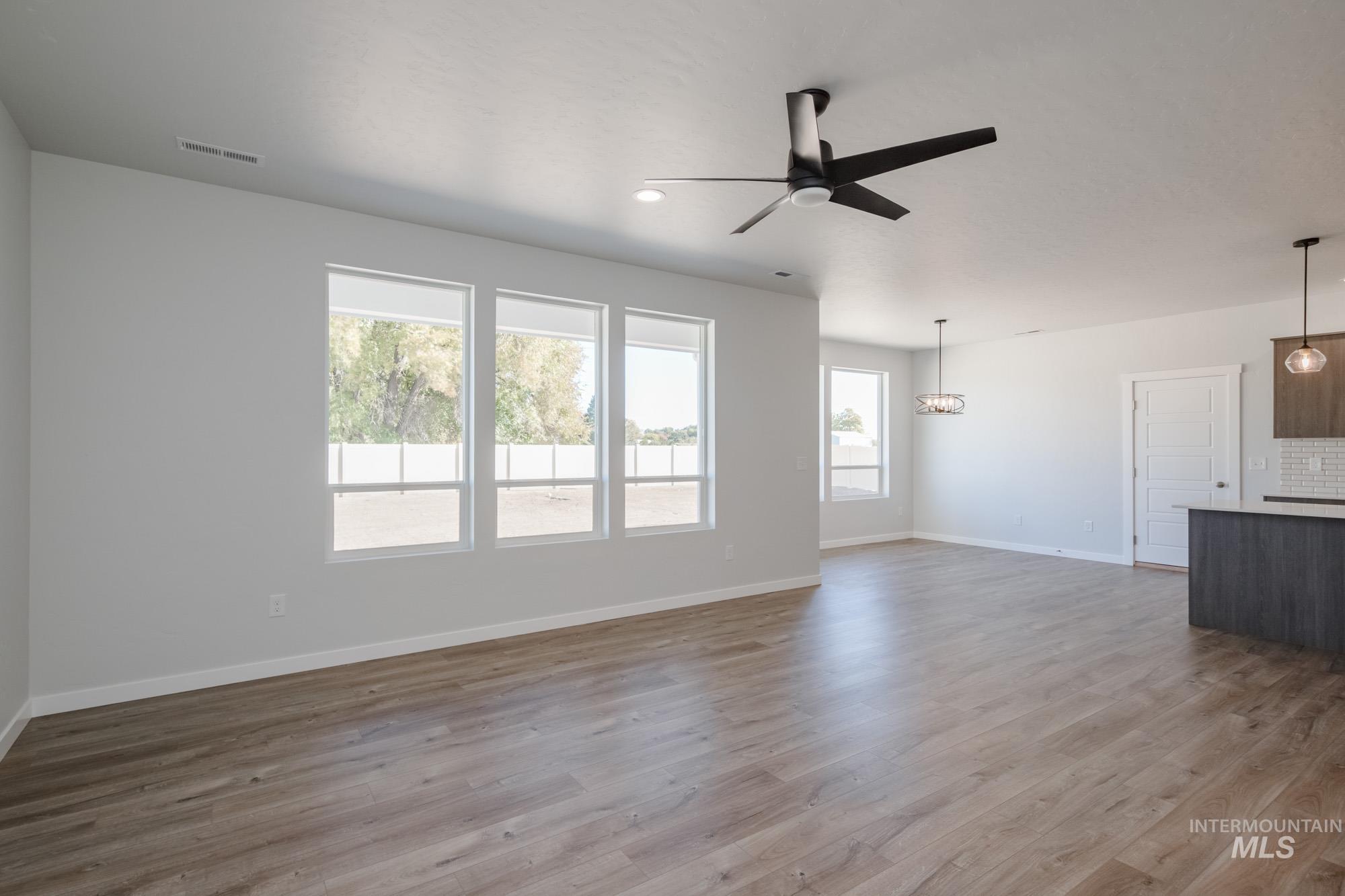 5304 Castleton Avenue Nampa, ID 83686 - Photo 12 of 25 Unfurnished living room with light wood-type flooring, ceiling fan, and recessed lighting