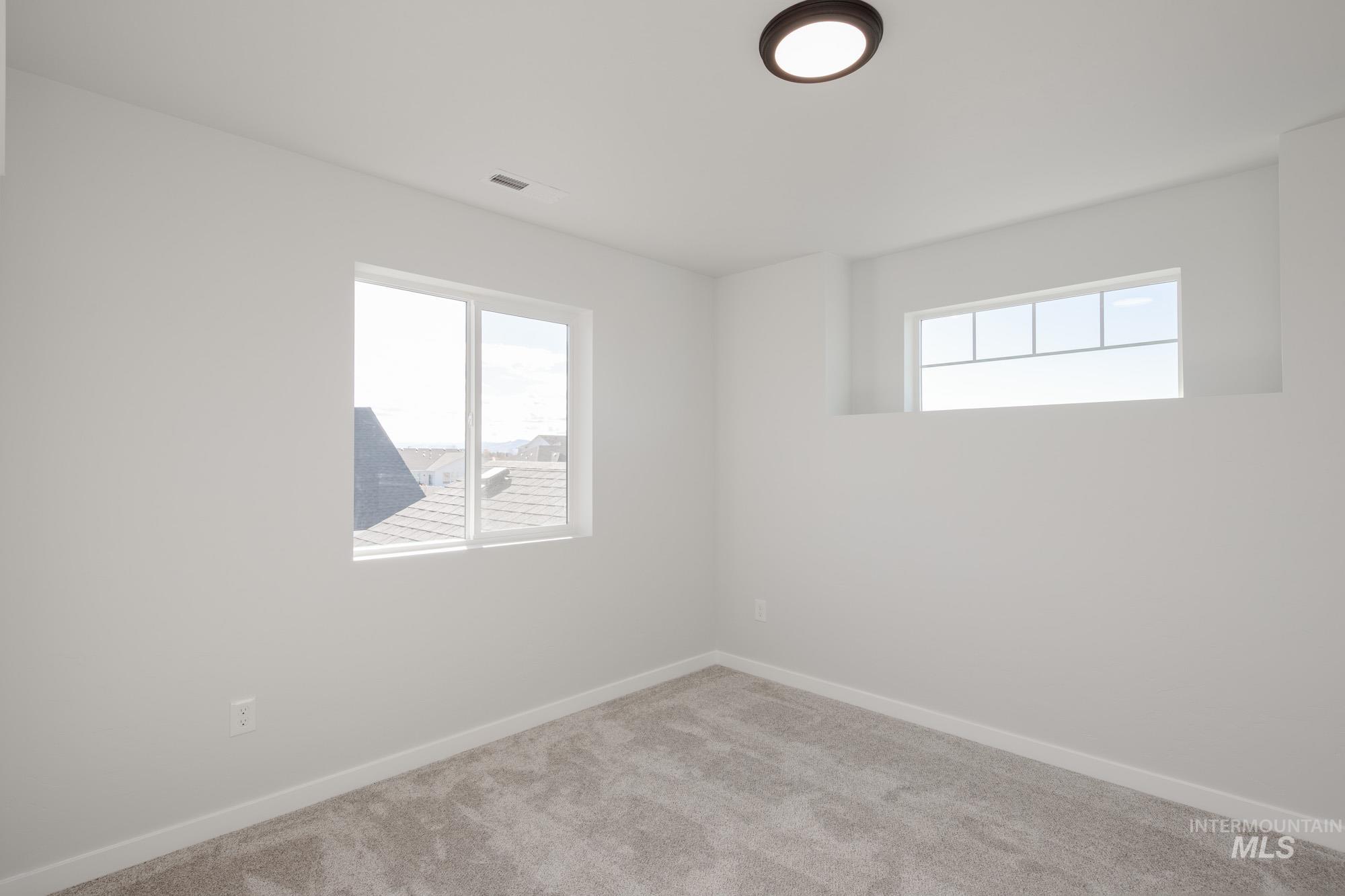 5304 Castleton Avenue Nampa, ID 83686 - Photo 23 of 25 Carpeted empty room with baseboards