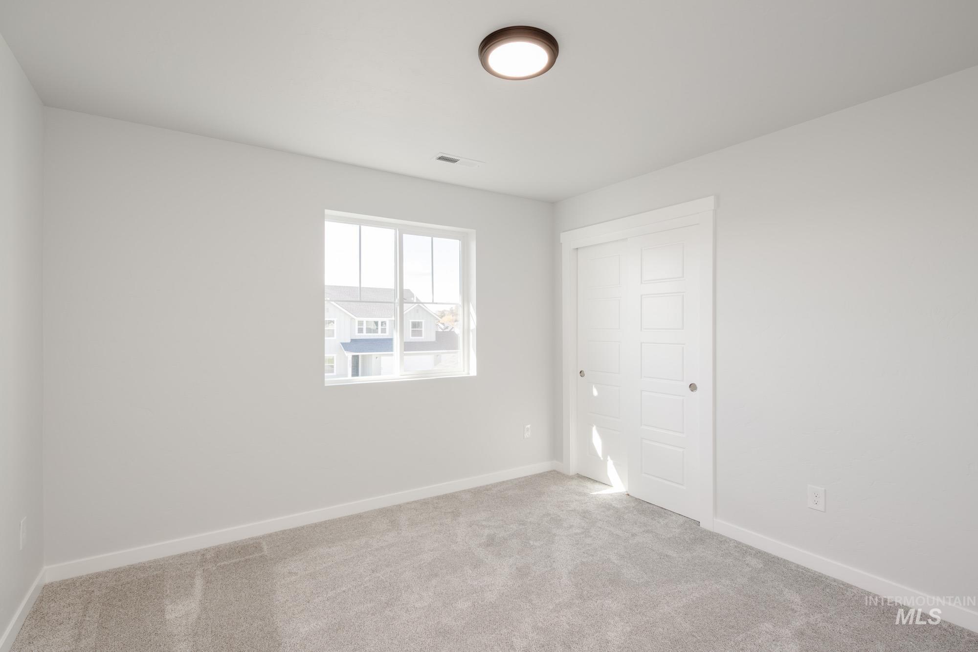 5304 Castleton Avenue Nampa, ID 83686 - Photo 24 of 25 Unfurnished bedroom with carpet and a closet