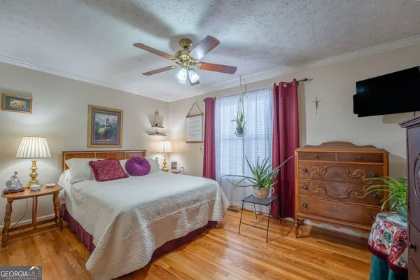 a bed room with a bed and a chandelier