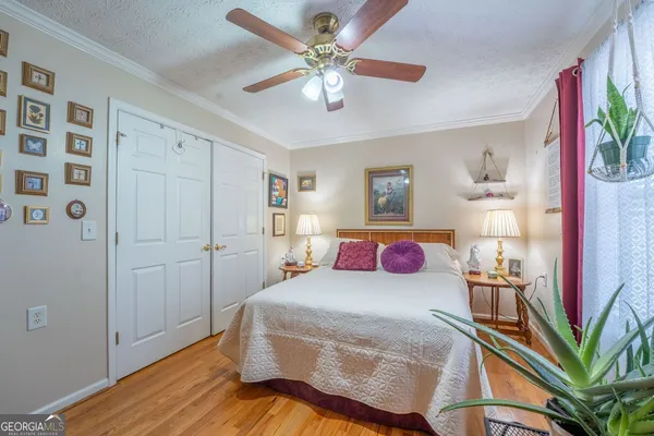 a bed room with a bed and a chandelier