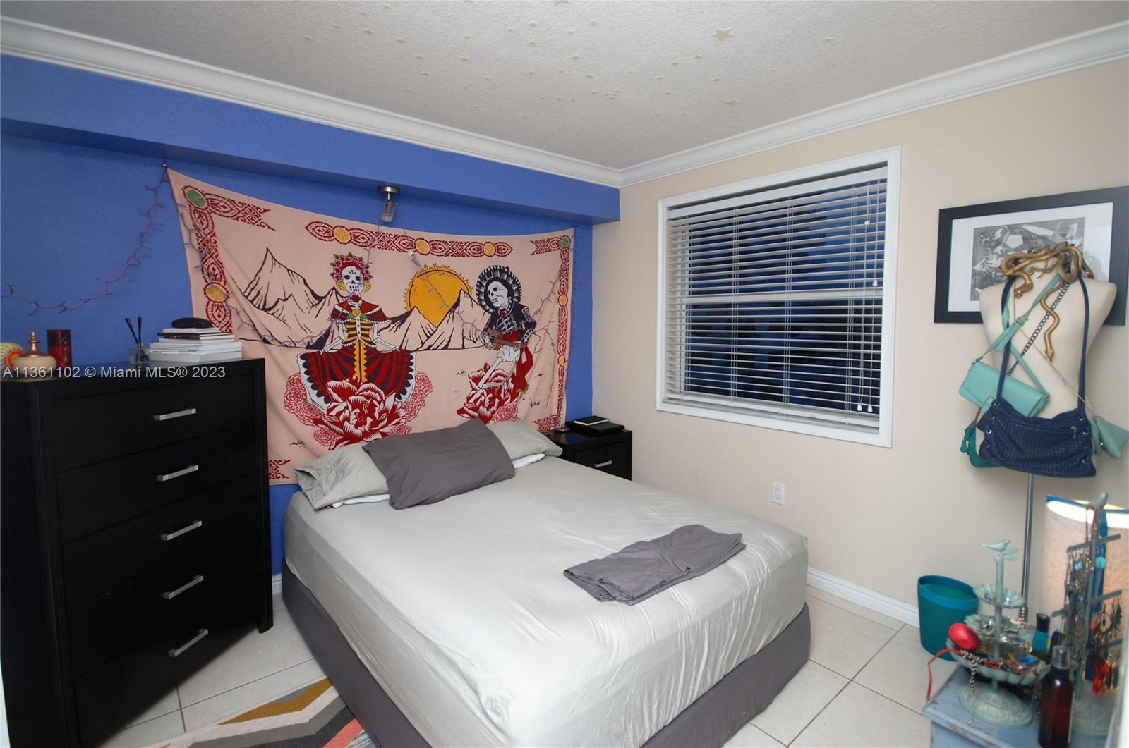 2575 Southwest 27th Avenue, Unit 409 Miami, FL 33133 - Photo 12 of 18 a bedroom with a bed and a window