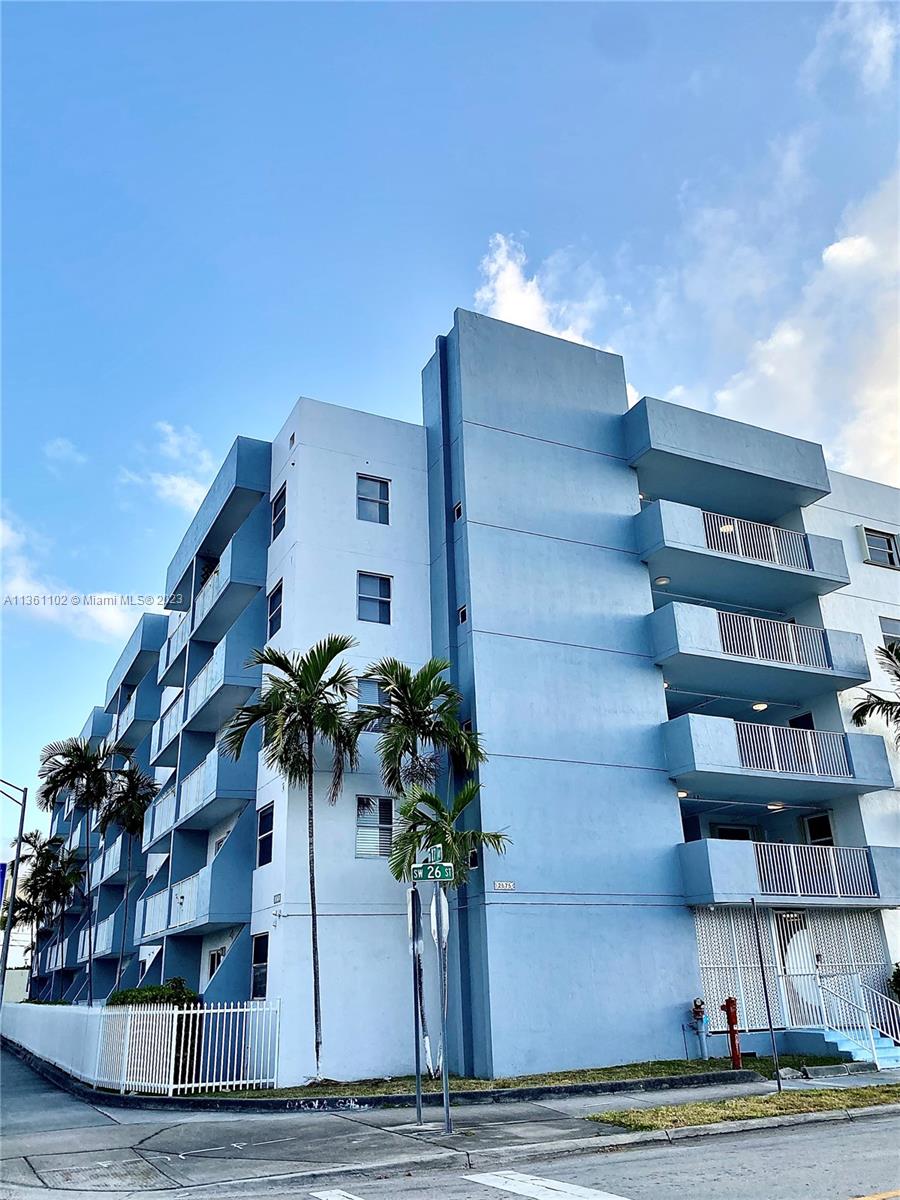 2575 Southwest 27th Avenue, Unit 409 Miami, FL 33133 - Photo 18 of 18 a vase of flowers sitting on a floor