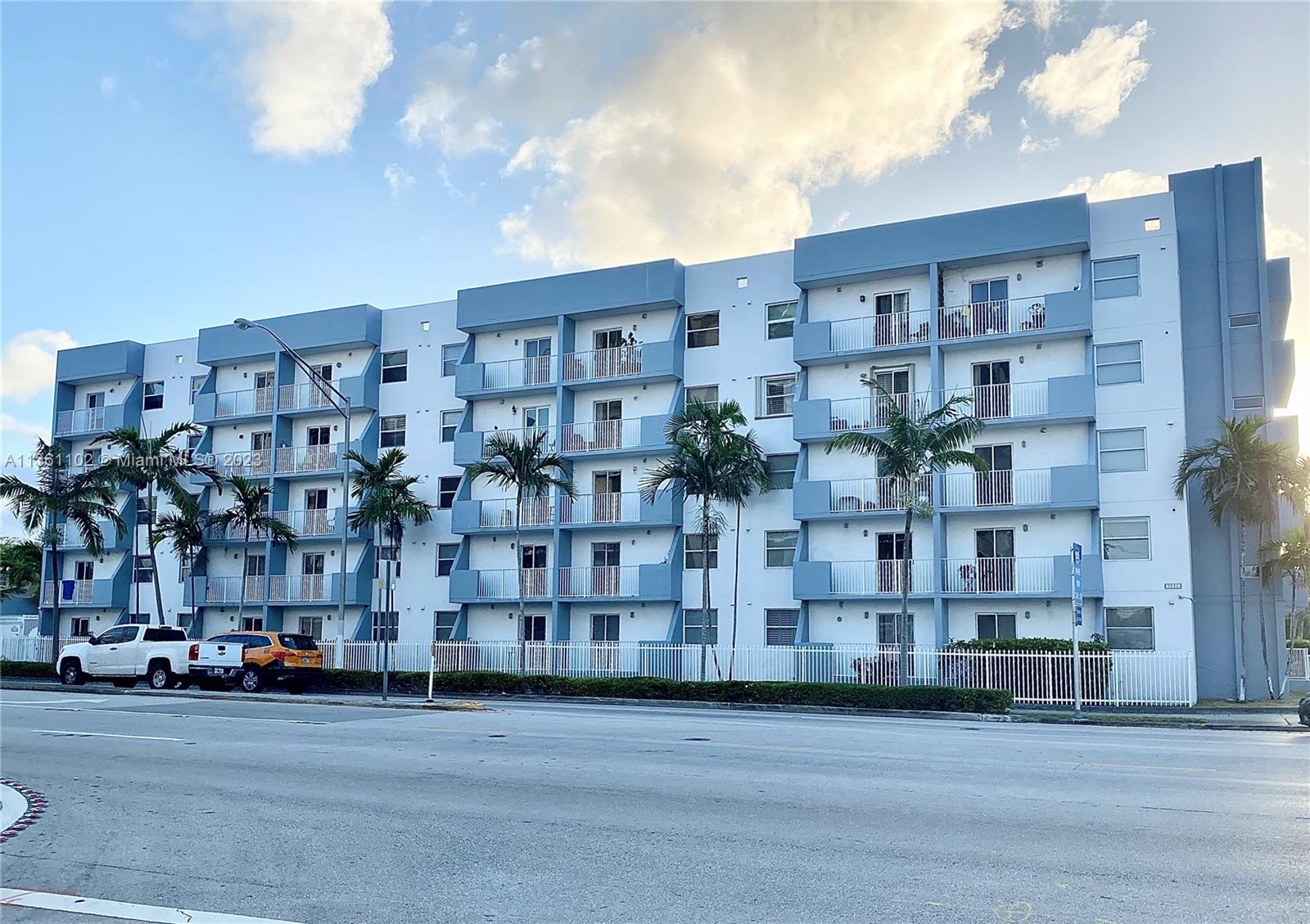 2575 Southwest 27th Avenue, Unit 409 Miami, FL 33133 - Photo 2 of 18 a city street lined with buildings and a yard