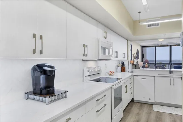 a kitchen with a sink and cabinets