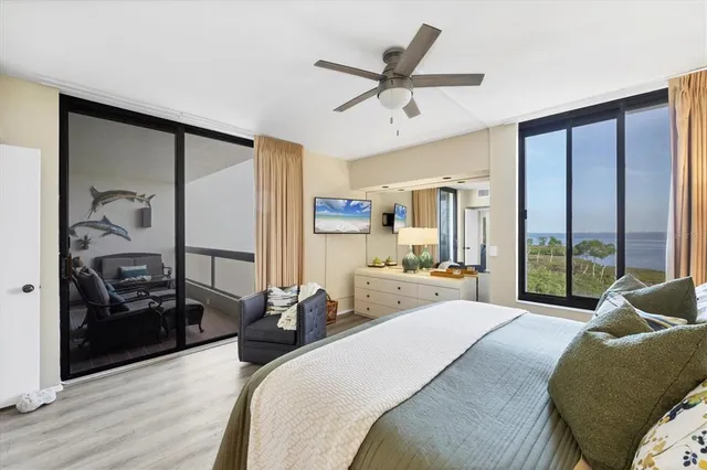 a large bedroom with a large bed and a large window