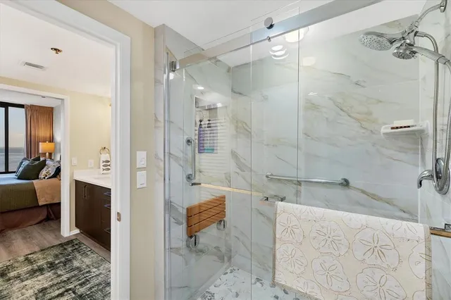 a bathroom with a shower and a sink