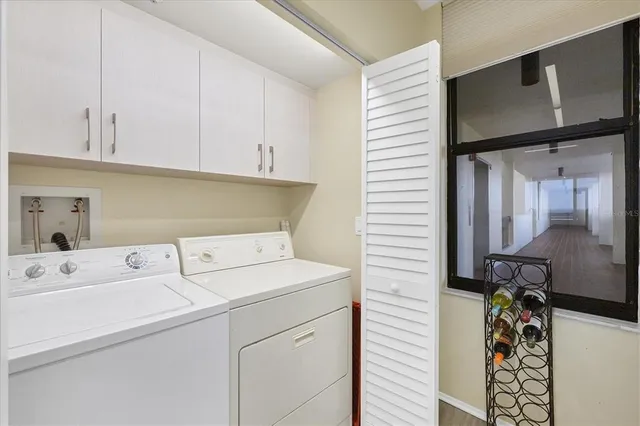 a utility room with dryer and washer