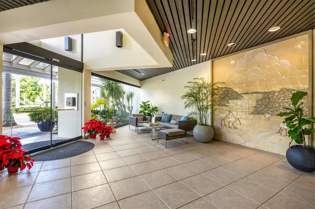 a room with furniture and flowers