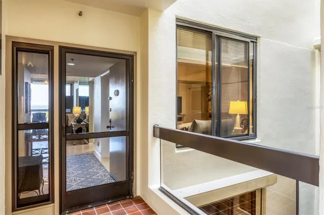 a view of a living room and a large window