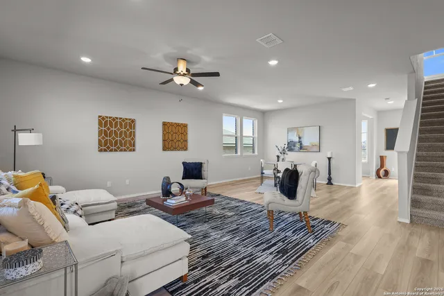 a bedroom with furniture and a chandelier