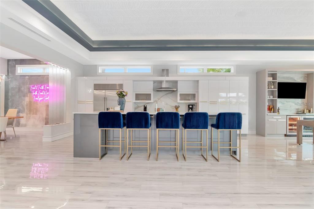 4936 West San Rafael Street Tampa, FL 33629 - Photo 12 of 42 a view of a dining room with furniture and wooden floor
