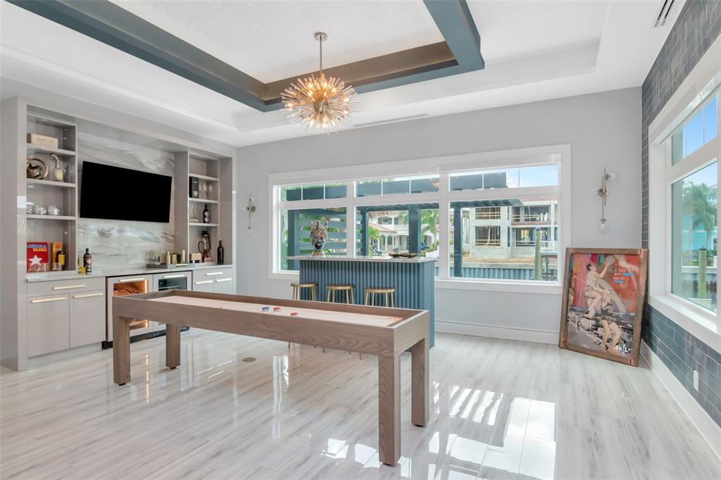 4936 West San Rafael Street Tampa, FL 33629 - Photo 14 of 42 a living room with furniture and a flat screen tv