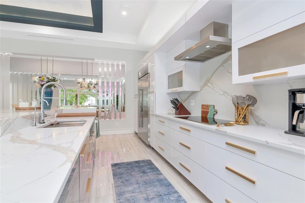 4936 West San Rafael Street Tampa, FL 33629 - Photo 15 of 42 a kitchen with a sink and refrigerator