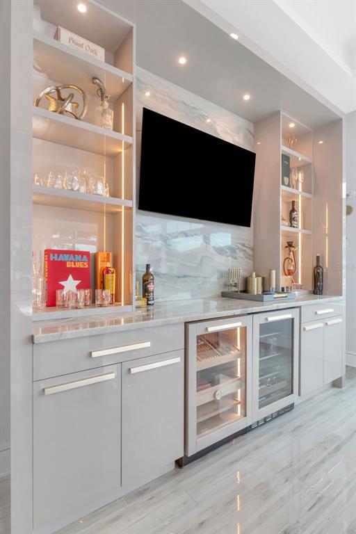 4936 West San Rafael Street Tampa, FL 33629 - Photo 16 of 42 a kitchen with stainless steel appliances kitchen island granite countertop a stove and a sink