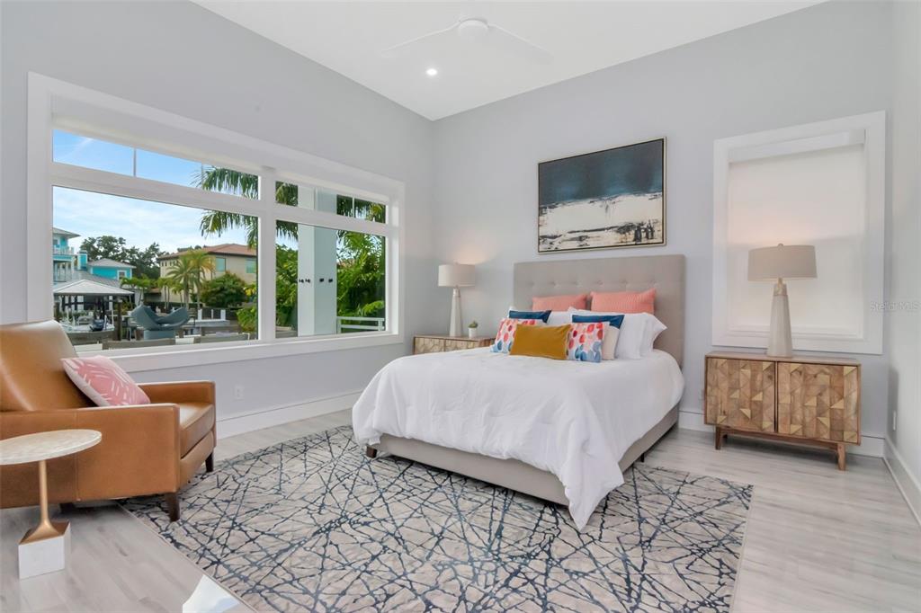 4936 West San Rafael Street Tampa, FL 33629 - Photo 18 of 42 a bedroom with a bed and glass window