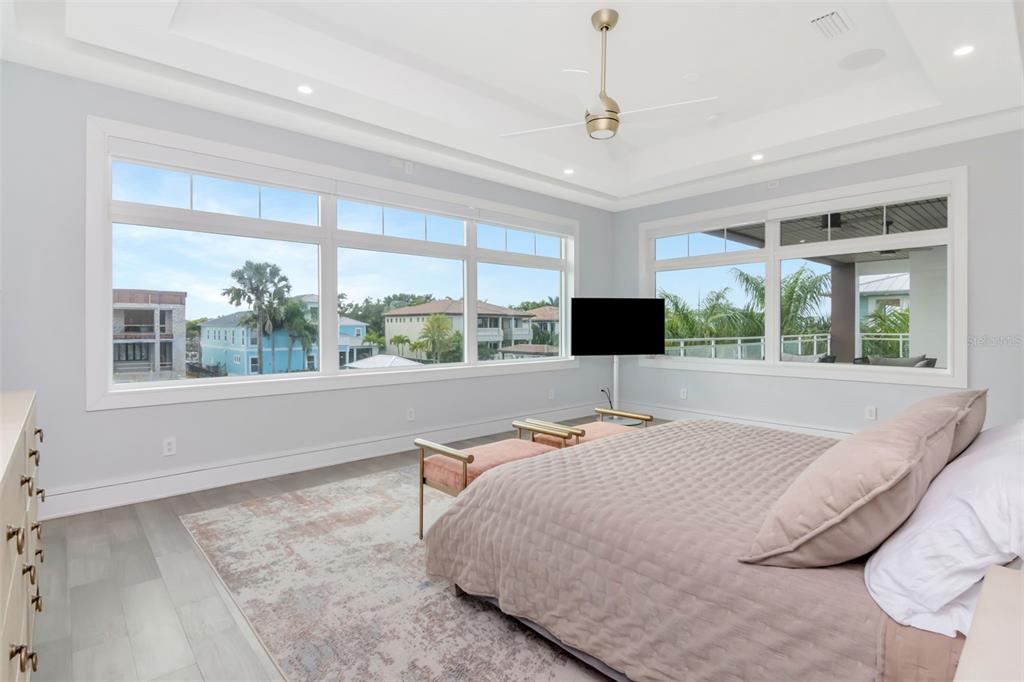 4936 West San Rafael Street Tampa, FL 33629 - Photo 19 of 42 a bed room with a bed television and a window