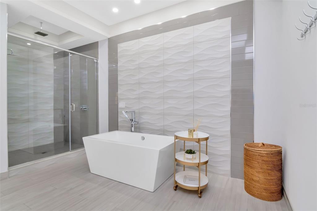 4936 West San Rafael Street Tampa, FL 33629 - Photo 22 of 42 a bathroom with a bathtub and shower