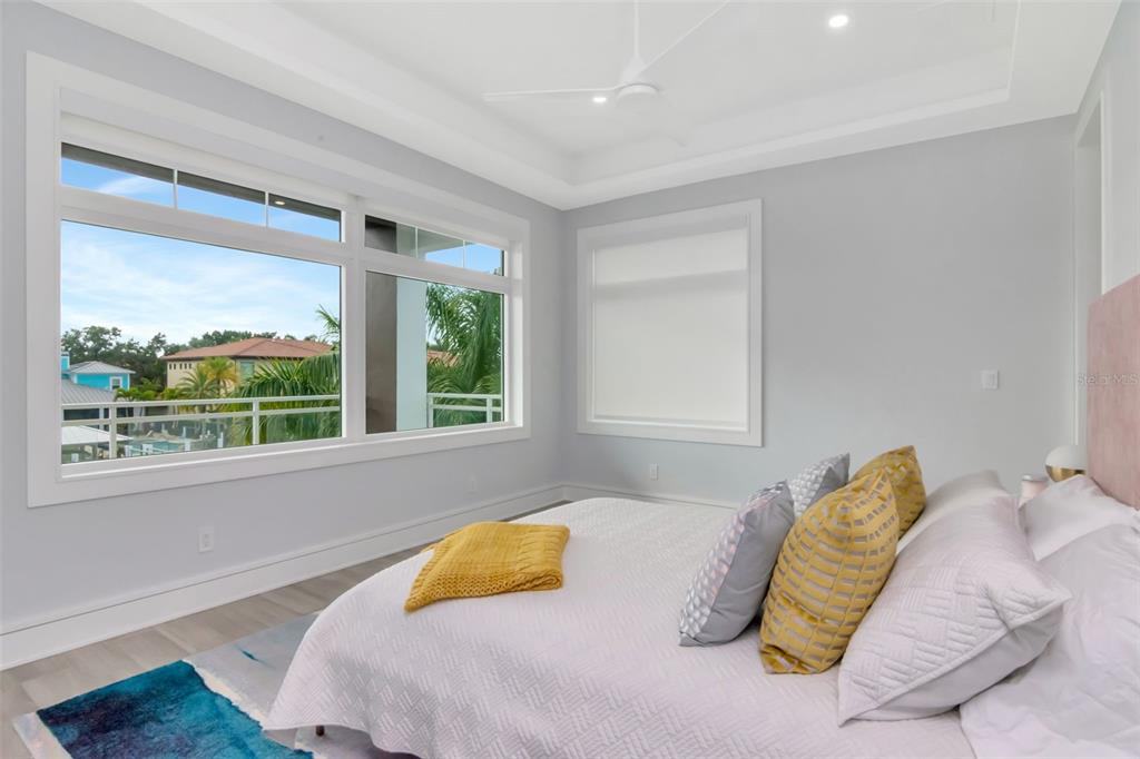 4936 West San Rafael Street Tampa, FL 33629 - Photo 25 of 42 a bedroom with a bed and a large window