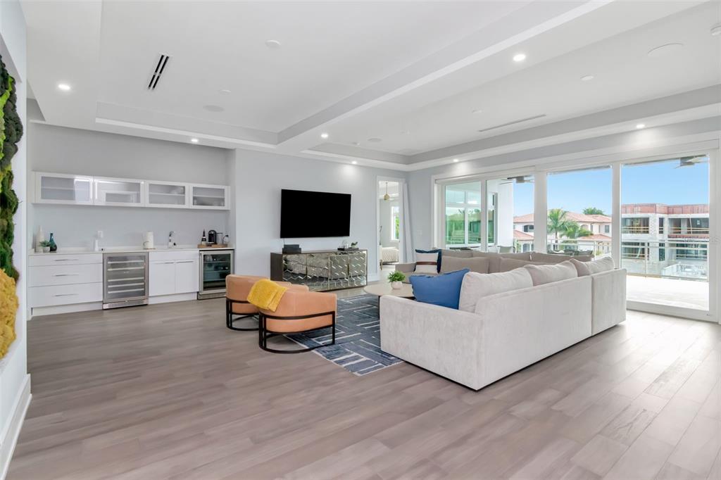 4936 West San Rafael Street Tampa, FL 33629 - Photo 26 of 42 a living room with furniture and a flat screen tv