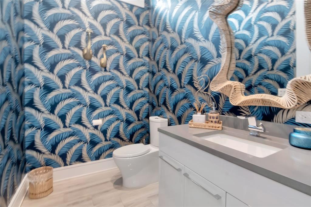 4936 West San Rafael Street Tampa, FL 33629 - Photo 30 of 42 a bathroom with a sink and mirror with toilet