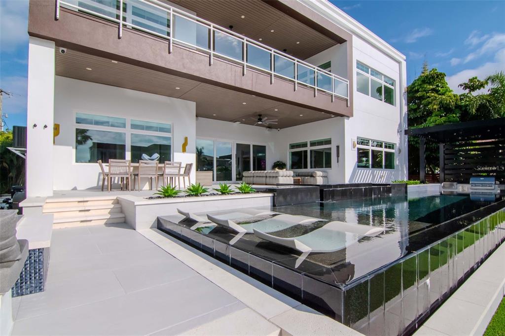 4936 West San Rafael Street Tampa, FL 33629 - Photo 37 of 42 a view of a swimming pool with furniture