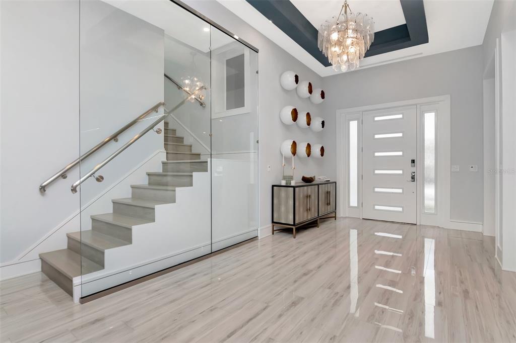 4936 West San Rafael Street Tampa, FL 33629 - Photo 8 of 42 a view of entryway with stairs and wooden floor