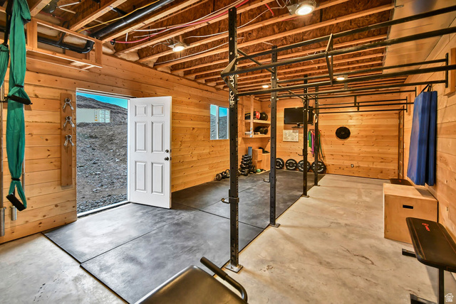 544 East 600 North, Unit 1 Joseph, UT 84739 - Photo 47 of 65 Finished basement space featuring exposed wood ceiling joists and wood-paneled walls