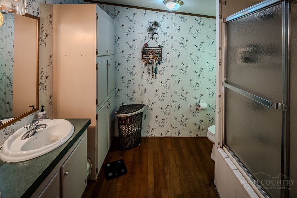461 Reuben Wooten Road Banner Elk, NC 28604 - Photo 22 of 39 a bathroom with a sink toilet and shower