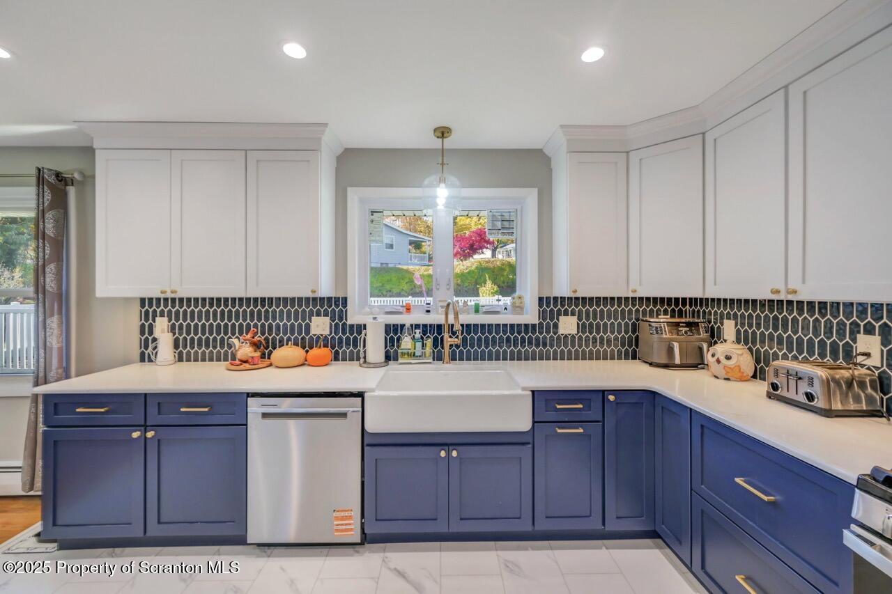 151 Primrose Avenue Clarks Summit, PA 18411 - Photo 13 of 58 a kitchen with a sink stove and cabinets
