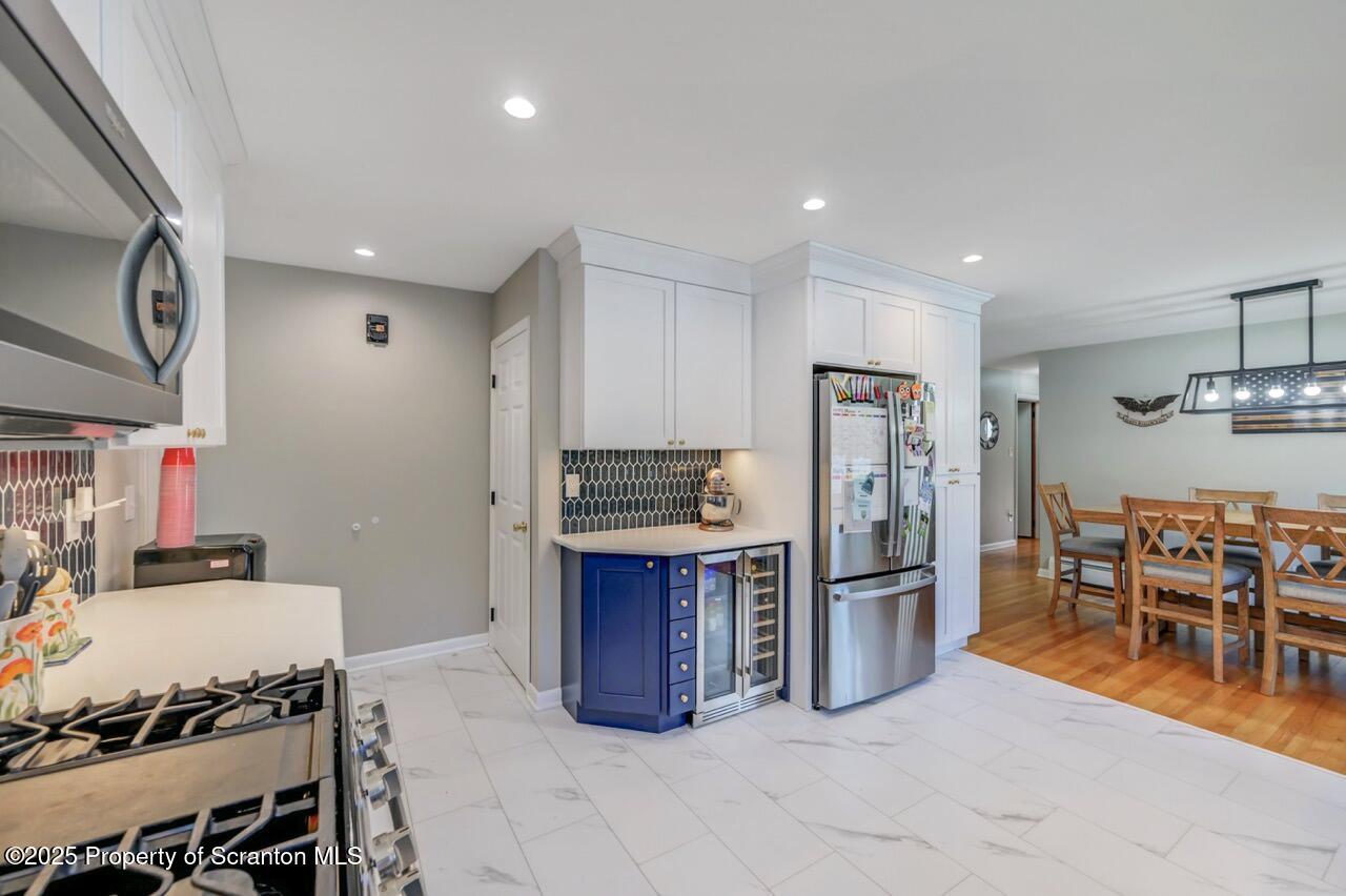151 Primrose Avenue Clarks Summit, PA 18411 - Photo 20 of 58 a kitchen with stainless steel appliances granite countertop a refrigerator and a stove top oven