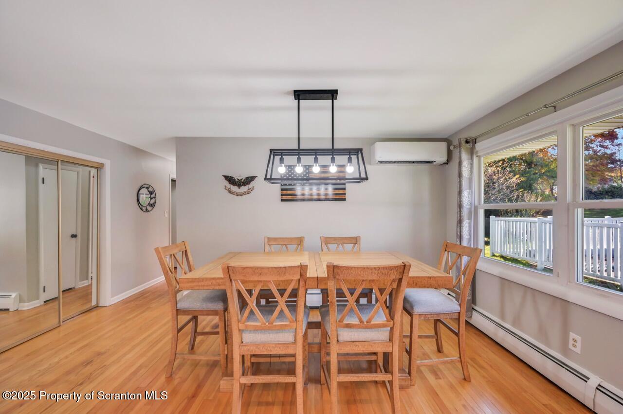 151 Primrose Avenue Clarks Summit, PA 18411 - Photo 23 of 58 a view of a dining room with furniture window and wooden floor
