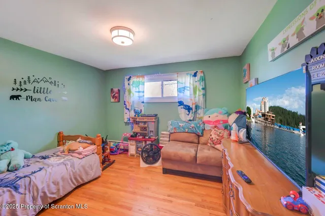 a bedroom with furniture and a window