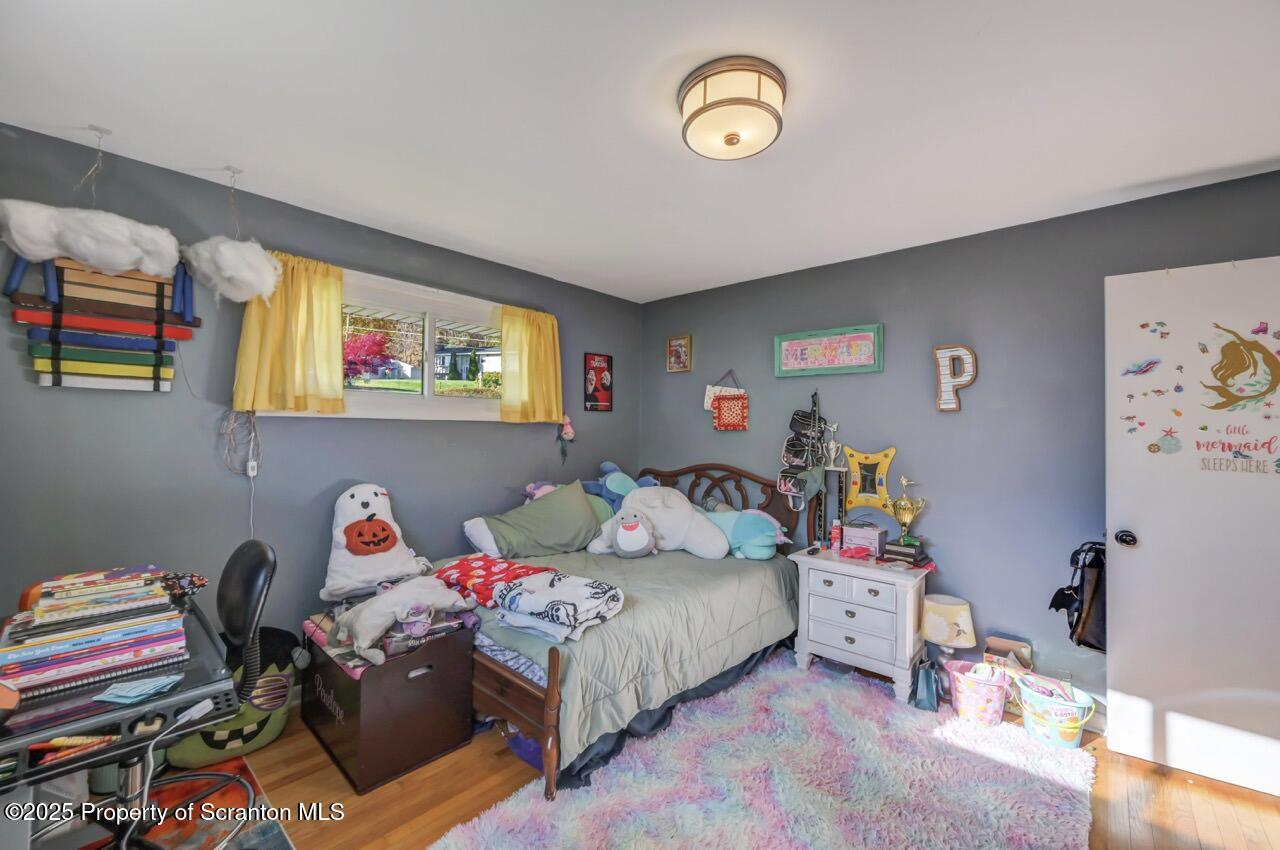 151 Primrose Avenue Clarks Summit, PA 18411 - Photo 37 of 58 a bedroom with a bed workspace and a window