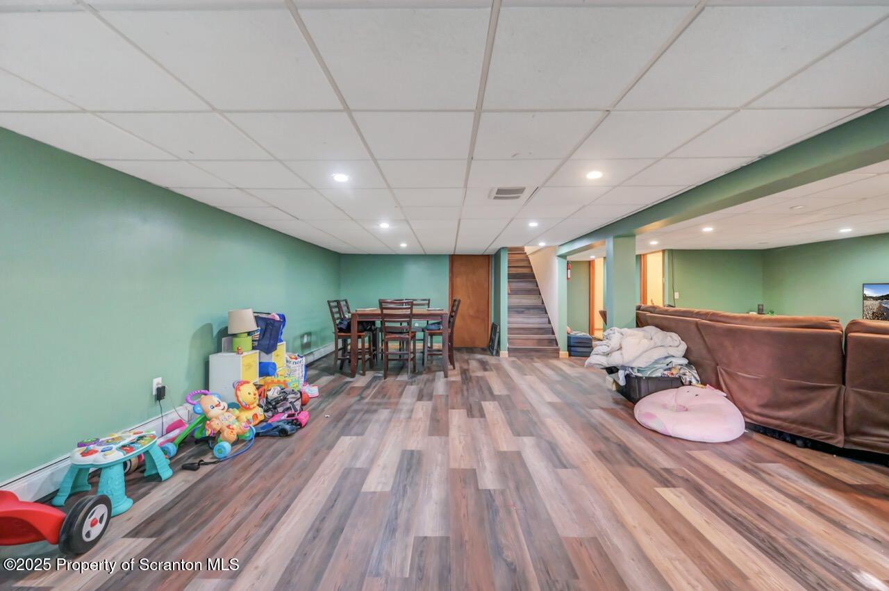 151 Primrose Avenue Clarks Summit, PA 18411 - Photo 40 of 58 a room with furniture and a wooden floor