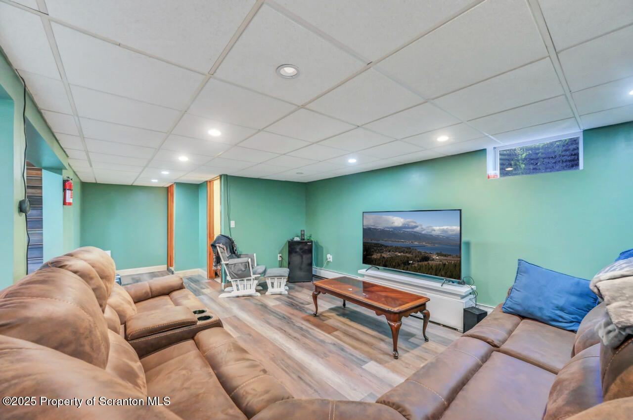 151 Primrose Avenue Clarks Summit, PA 18411 - Photo 41 of 58 a living room with furniture and a flat screen tv
