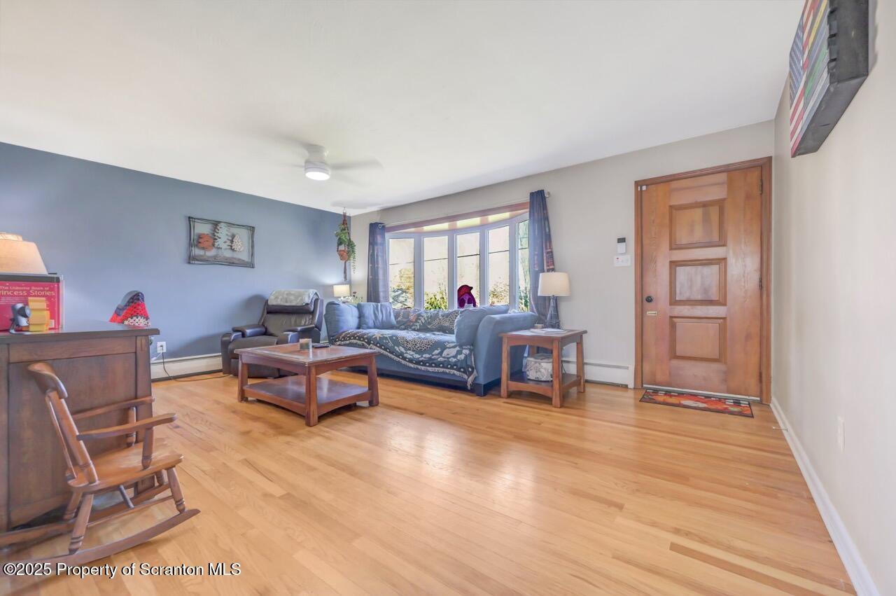 151 Primrose Avenue Clarks Summit, PA 18411 - Photo 5 of 58 a living room with furniture and a wooden floor