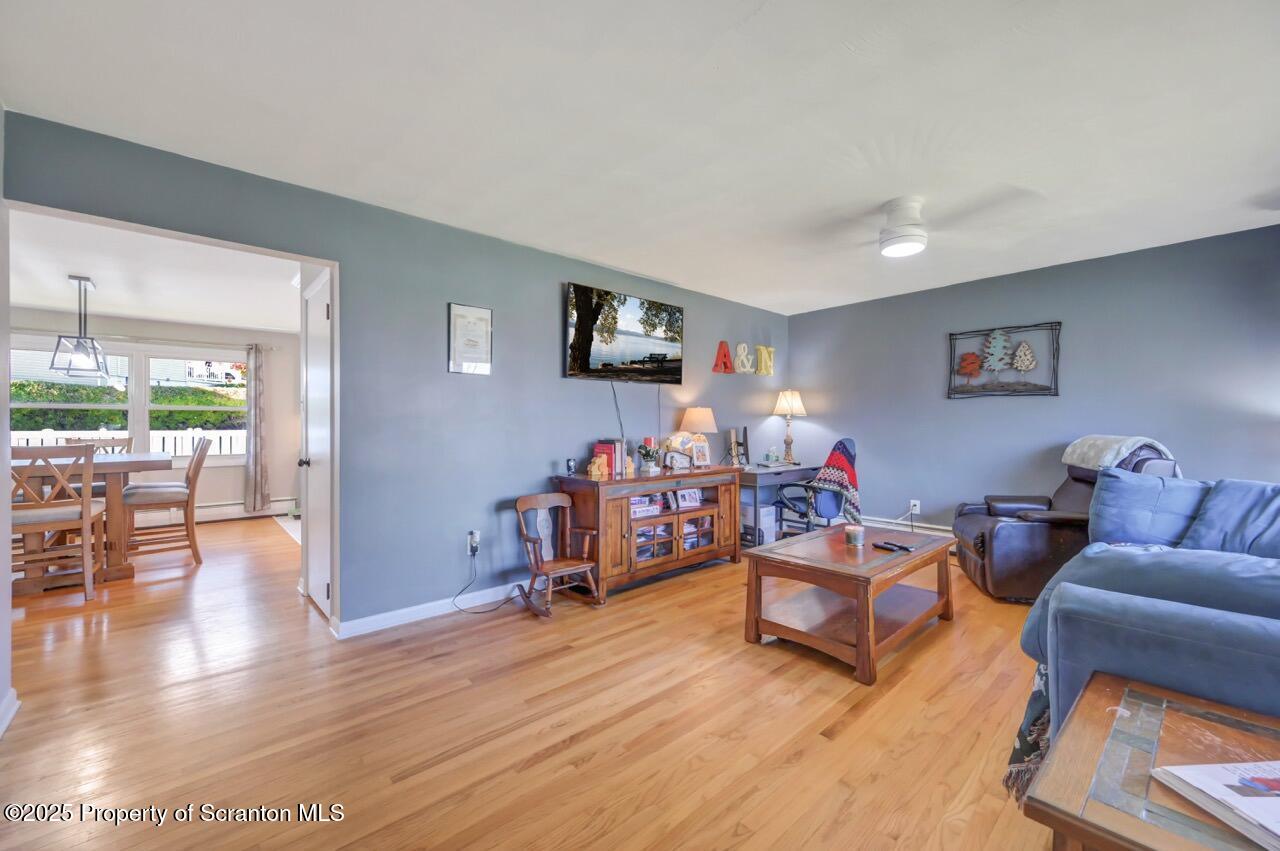 151 Primrose Avenue Clarks Summit, PA 18411 - Photo 6 of 58 a living room with furniture and wooden floor